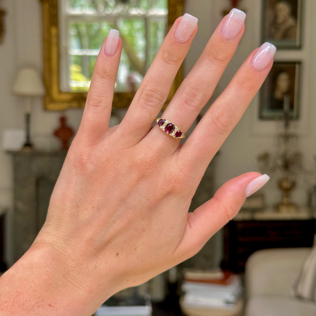 Antique Edwardian three stone ruby and diamond ring,worn on hand. 