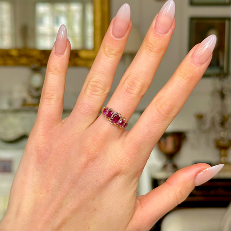 Victorian five-stone garnet and yellow gold ring, worn on hand. 