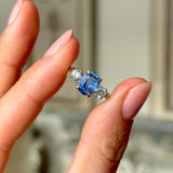 Vintage, 1950s sapphire & diamond three-stone ring held in fingers