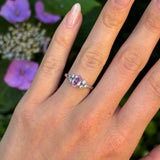 Vintage, 1970s pink sapphire & diamond ring worn on hand.