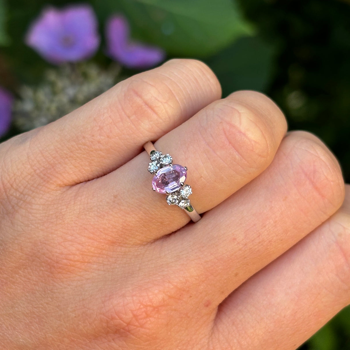 Vintage, 1970s pink sapphire & diamond ring worn on hand.