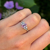 Vintage, 1970s pink sapphire & diamond ring worn on hand.