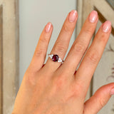 Vintage, 1980s ruby & diamond ring worn on hand.