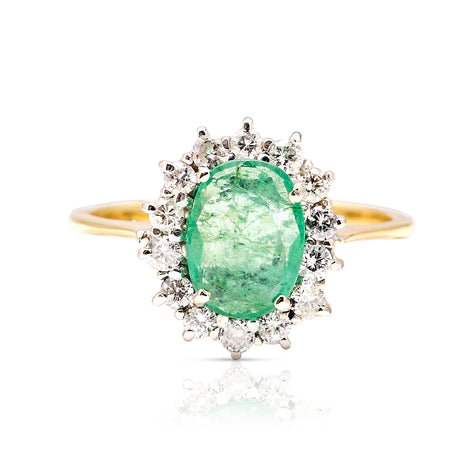 Vintage, 1990s emerald & diamond cluster ring worn on hand front