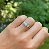 Vintage, Art Deco three-stone diamond ring, 18ct white gold & platinum worn on hand.