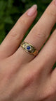 Antique, Edwardian sapphire and diamond three-stone gypsy ring worn on hand.