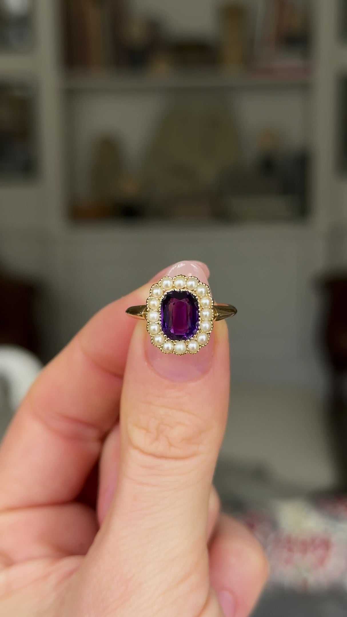 Antique, Edwardian Amethyst and Pearl Cluster Ring, 18ct Yellow Gold held in fingers and rotated to give perspective.