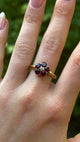 Antique, Victorian garnet cluster ring, 18ct yellow gold on hand.