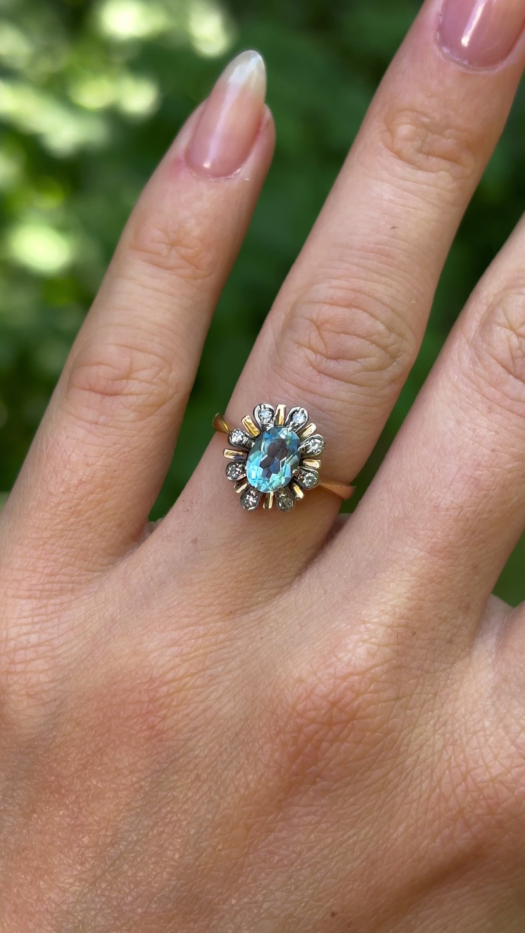 Vintage, 1970s aquamarine & diamond cluster ring, 18ct yellow gold worn on hand.