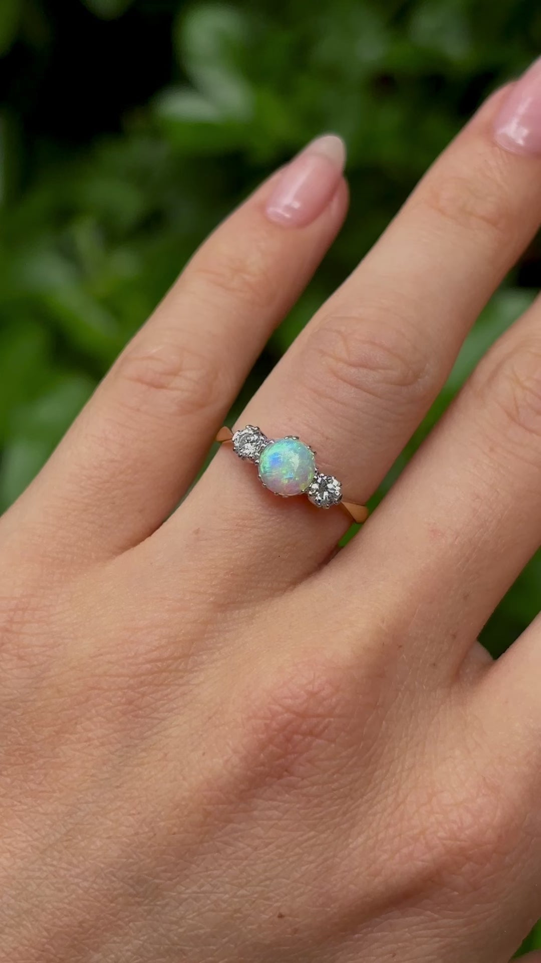 Antique, Edwardian opal and diamond three-stone ring on hand in video.