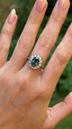 Vintage, 1970s teal sapphire and diamond cluster, 18ct yellow gold and platinum worn on hand.