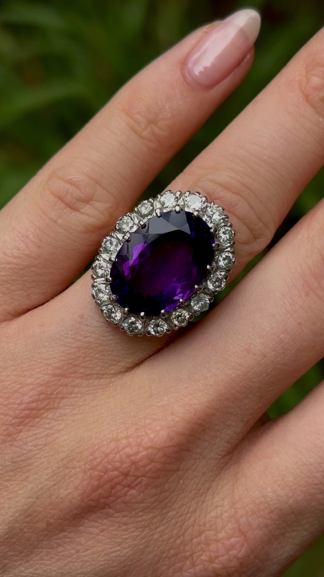 Antique, vintage amethyst & diamond cluster ring on hand.