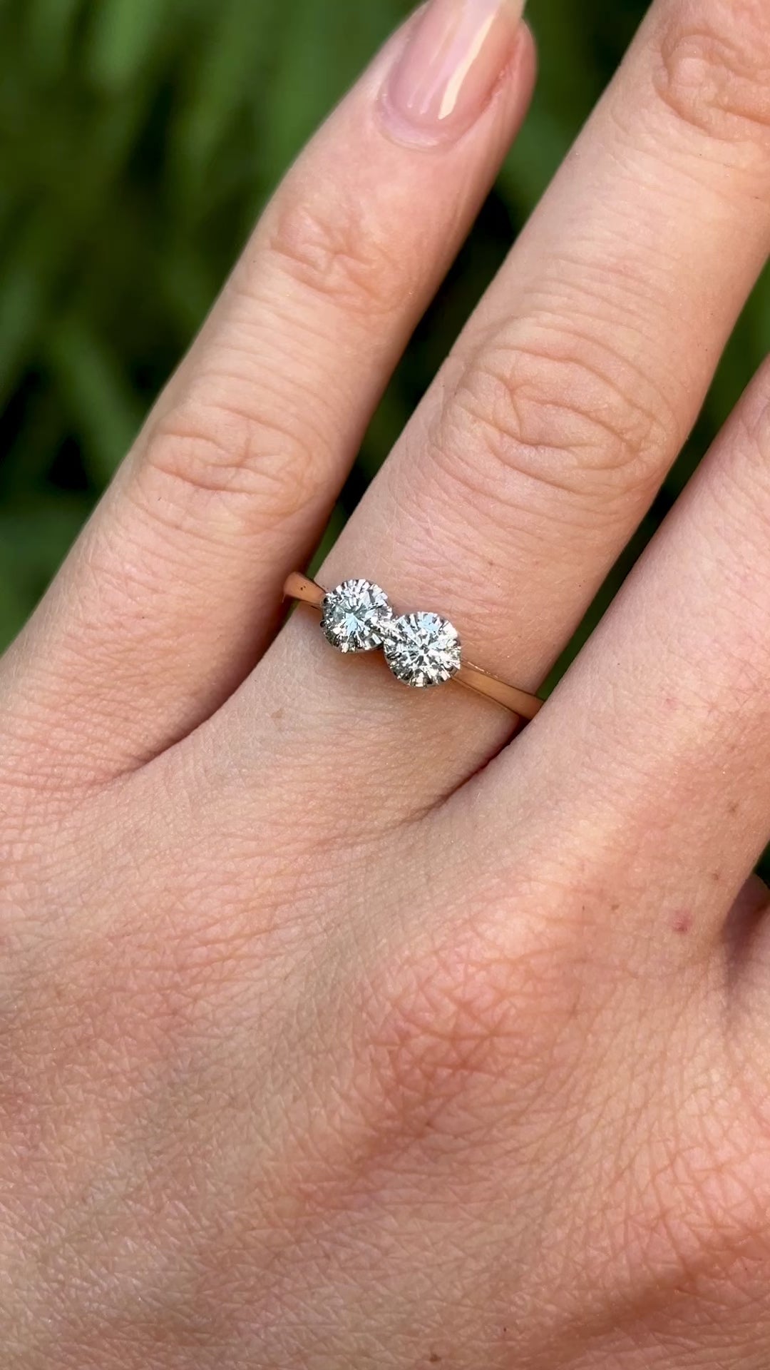 Vintage, 1990s diamond engagement ring worn on hand.