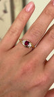 Antique, Edwardian ruby & diamond twist ring worn on hand.