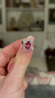 Vintage, Pink Tourmaline and Diamond Ring, 18ct White Gold held in fingers and rotated to give perspective.