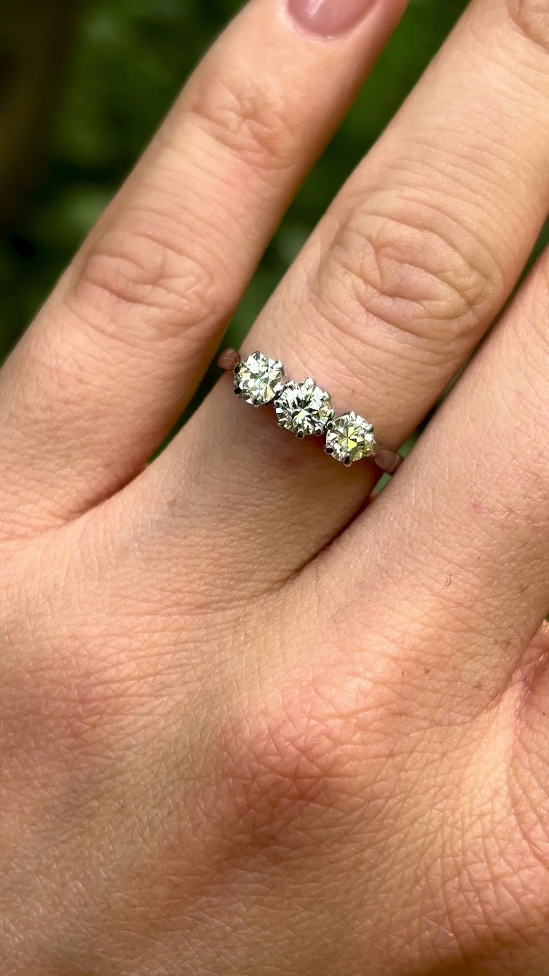 Vintage, 1980s three-stone diamond ring, platinum worn on  hand.