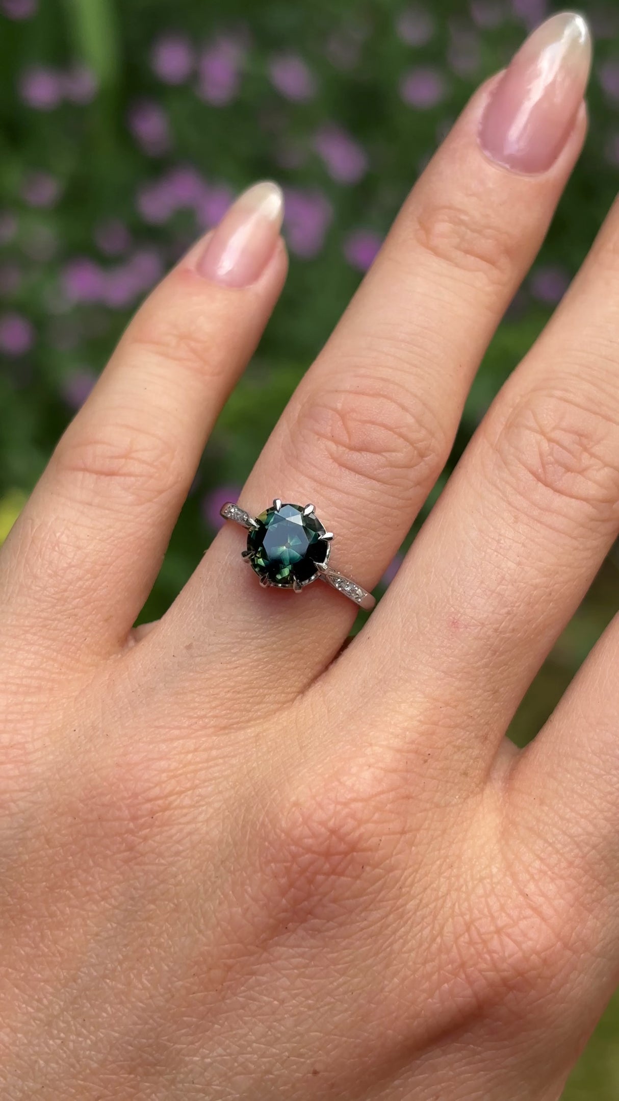 Antique, Edwardian teal sapphire & diamond ring, platinum worn on hand.