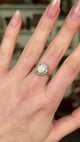 Antique, Edwardian White Opal and Diamond Cluster Ring worn on hand and rotated to give perspective.