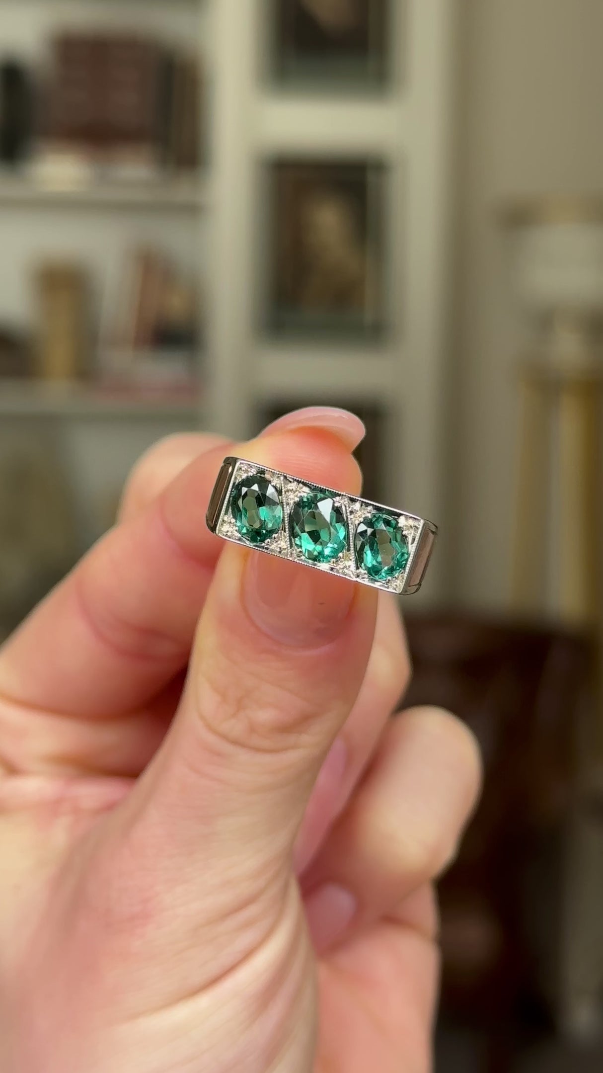 Vintage, 1950s Three-Stone Indicolite Tourmaline Ring, 14ct Rose and White Gold held in fingers and rotated to give perspective.