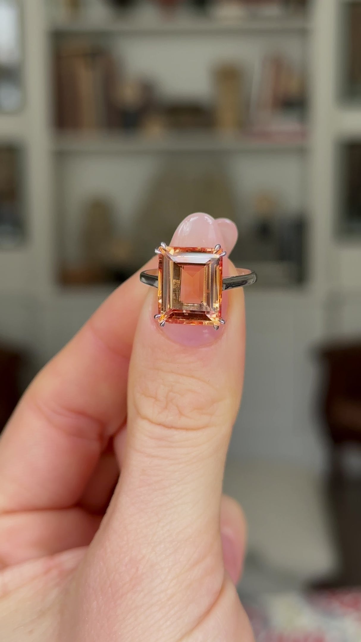 Vintage, Imperial Topaz Single-Stone Ring, 18ct White Gold held in fingers and rotated to give perspective.