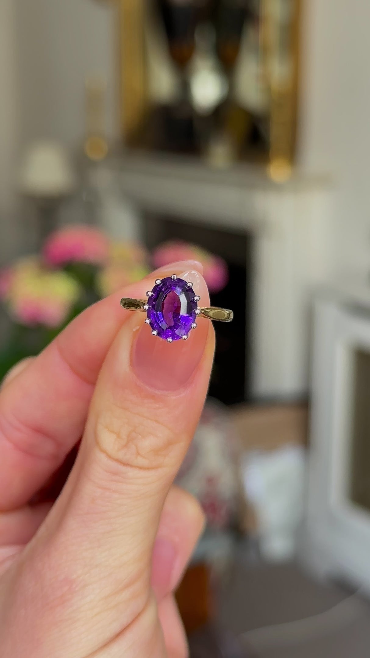 Vintage, 1970s Amethyst Single-Stone Ring, 18ct Yellow Gold and Platinum held in fingers and rotated to give perspective.