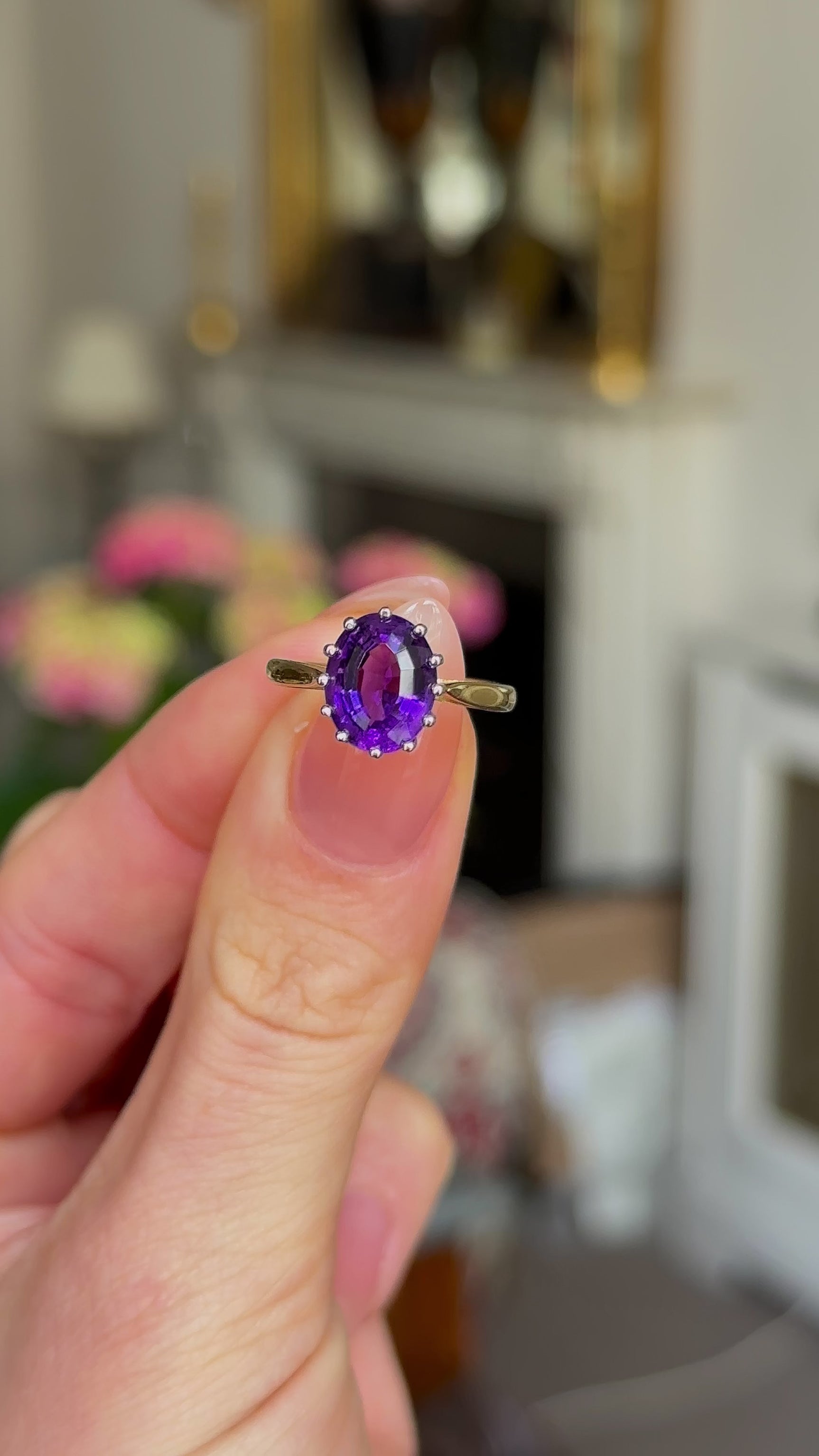 Vintage, 1970s Amethyst Single-Stone Ring, 18ct Yellow Gold and Platinum held in fingers and rotated to give perspective.