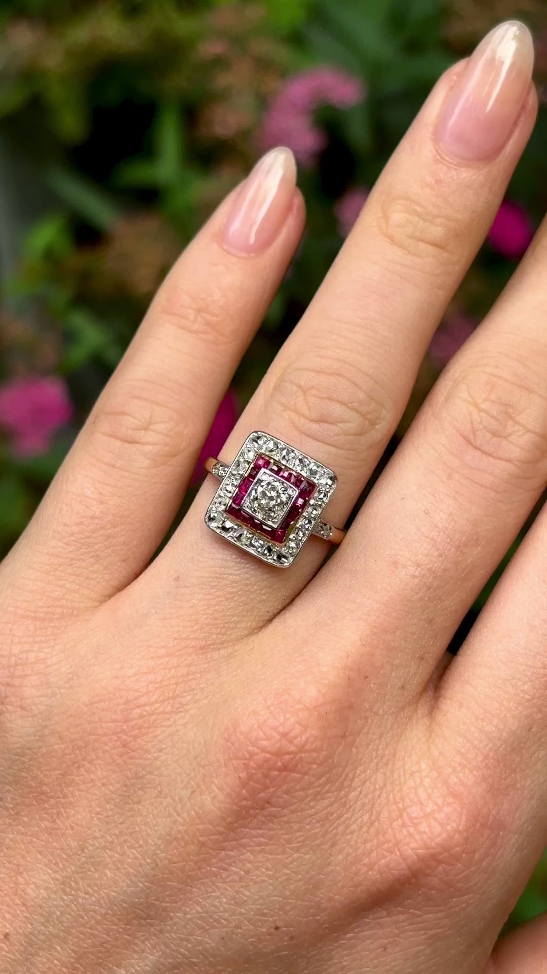 Vintage, diamond and ruby cluster ring, 18ct yellow gold and platinum worn on hand.