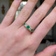 Five stone emerald and diamond ring worn on hand and moved around to give perspective.