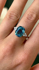 Vintage, 1970s blue topaz & diamond ring worn on hand.