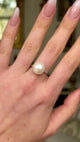 Antique, Edwardian Pearl and Diamond Ring, worn on hand and moved around to give perspective.