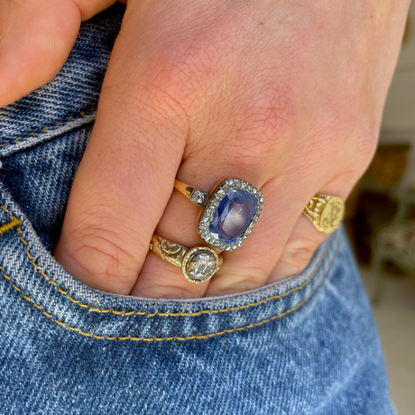 Early Victorian sapphire and diamond engagement ring, worn on hand.