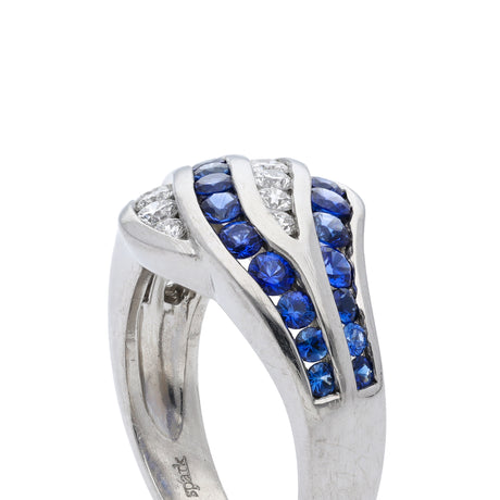 An unusual sapphire and diamond wave ring, side view.