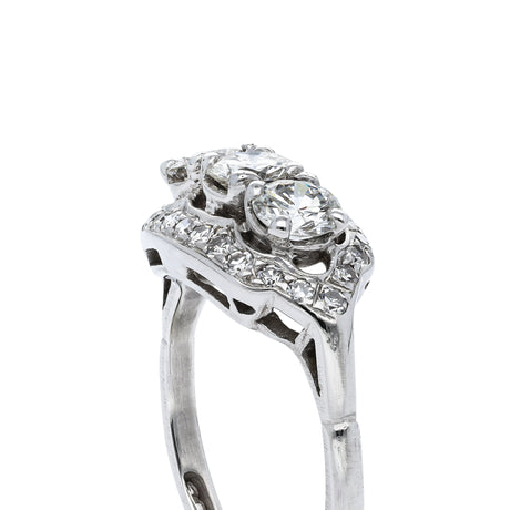 Art Deco three-stone diamond engagement ring, side view.