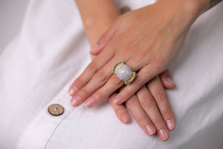 Cartier diamond bombe ring, front view worn on hand.