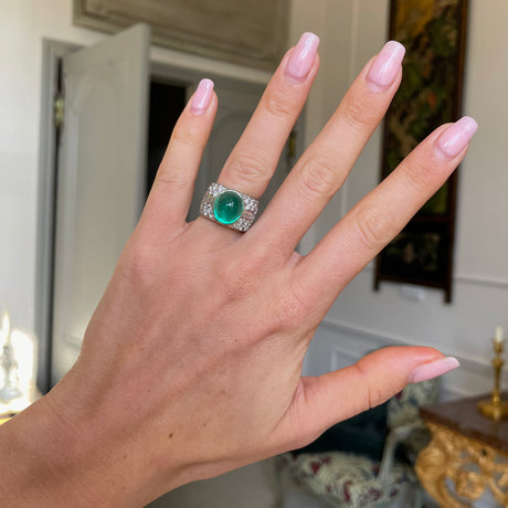 Trabert Hoeffer Mauboussin Art Deco emerald and diamond ring, worn on hand.