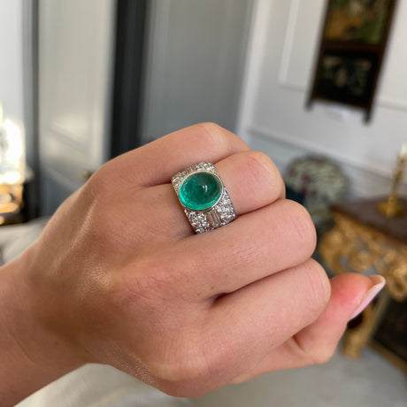 Trabert Hoeffer Mauboussin Art Deco emerald and diamond ring, worn on hand.