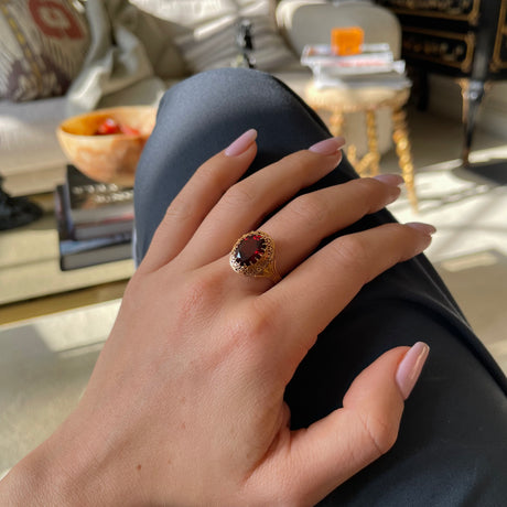 Belle Époque red garnet ring, worn on hand. 