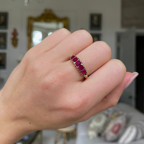 Edwardian five stone ruby band, worn on hand.