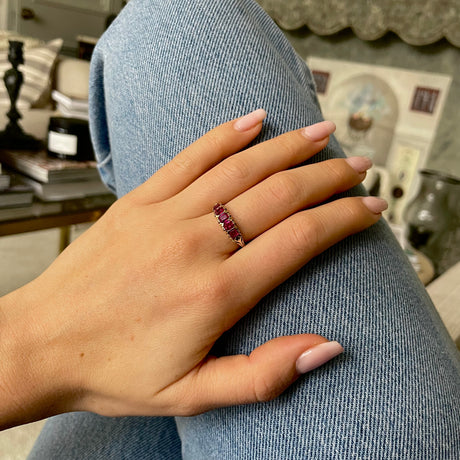 Edwardian five stone ruby band, worn on hand.