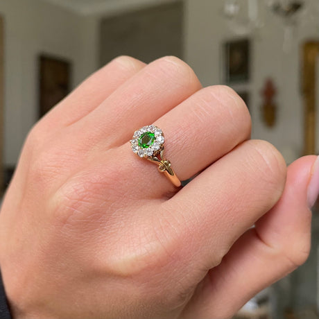 Edwardian, demantoid garnet and diamond cluster ring, worn on hand.