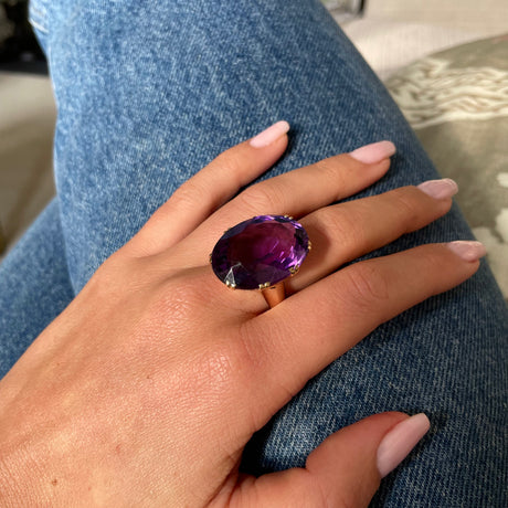 Victorian amethyst cocktail ring, worn on hand.