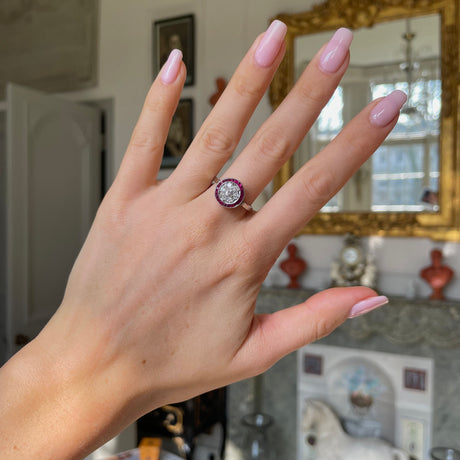 Art Deco ruby and diamond ring,  worn on hand.