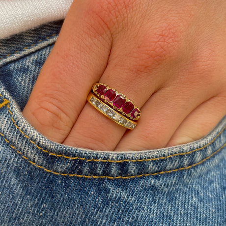 Edwardian five stone ruby band, worn on hand.