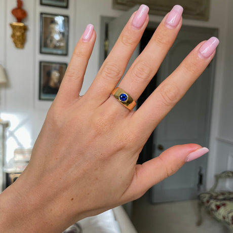 Victorian Burmese sapphire engagement ring, worn on hand.