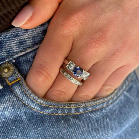 Art Deco three stone sapphire and diamond ring, worn on hand in pocket of jeans.