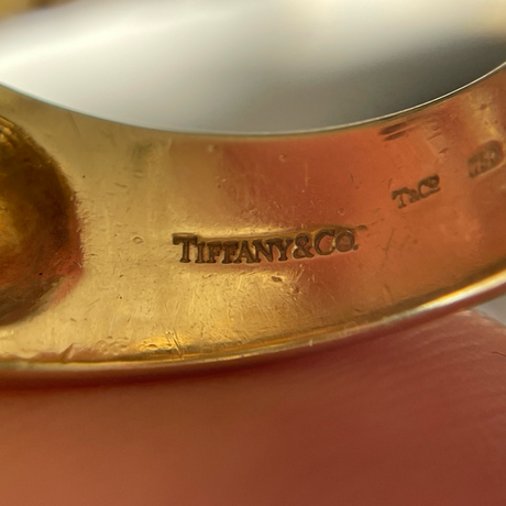 Vintage Tiffany&Co. yellow gold band, close up of makers marks.