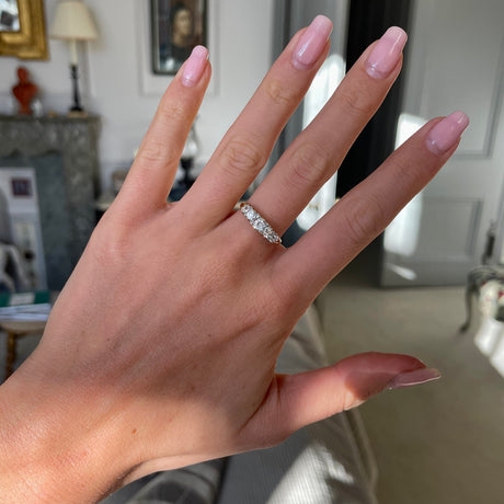 Victorian five stone diamond engagement ring, worn on hand.