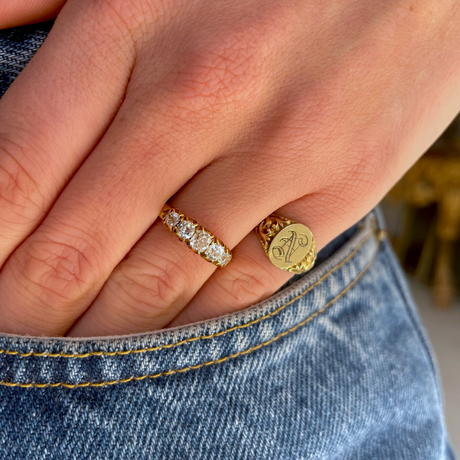 Victorian five stone diamond engagement ring, worn on hand.